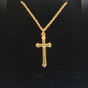 Gold tone crucifix necklace with inset stone.